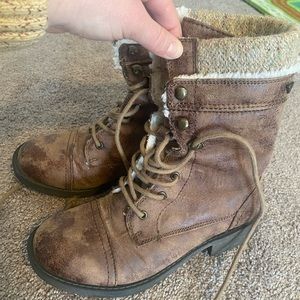 Weathered, lace up boots lined with soft fur